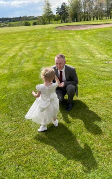 Gavin McNamara-Jones and his daughter at a wedding