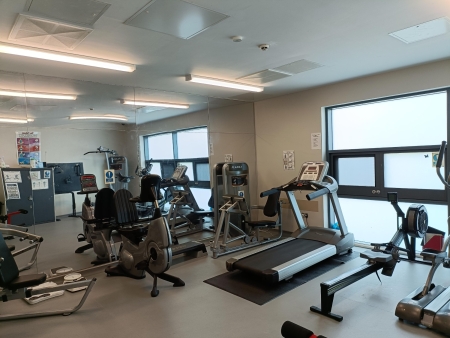 Images of gym aquipment, running machines, cross trainers exercise bikes in a ward based gym